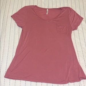 A cute pink v neck T-shirt with a small pocket!